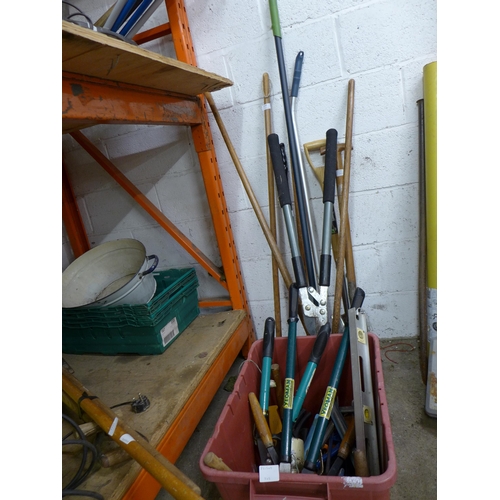 A box of assorted gardening tools including loppers, hedge cutters, trowels, etc., and seven other gardening tools including hoes, a spade, brushes etc.