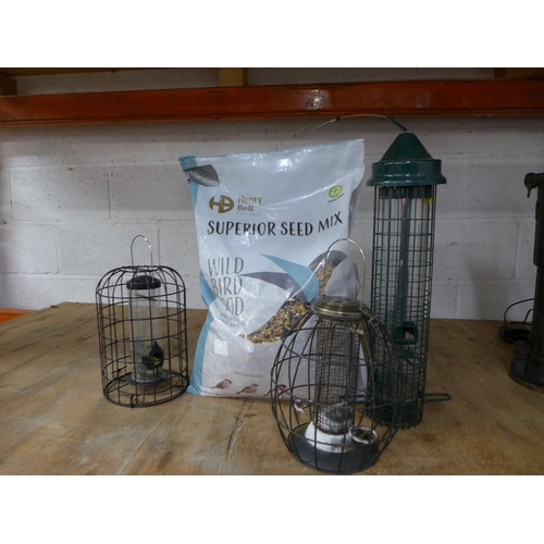 2241 - Three assorted bird feeders and a large bag of Henry Bell Superior Seed Mix wild bird food