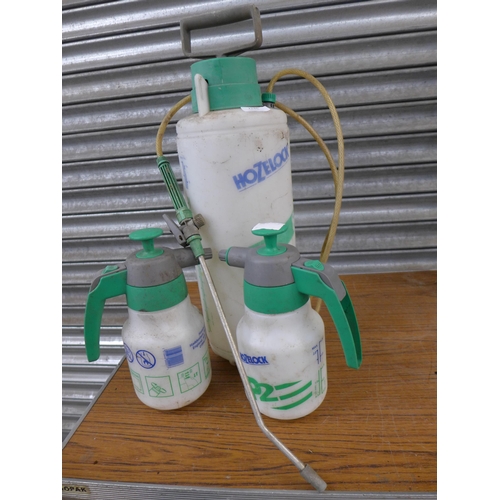 2246 - Two Hozelock P2 Polyspray spray bottles, a Hozelock 8l Killaspray spray bottle, a 240v pond pump and... 