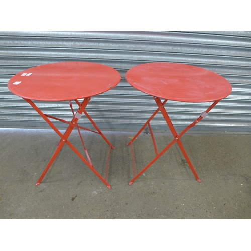 2269 - 2 Red metal folding circular garden tables