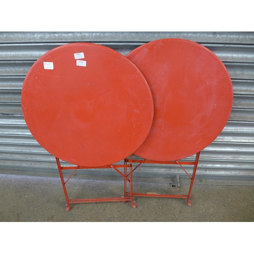 2269 - 2 Red metal folding circular garden tables