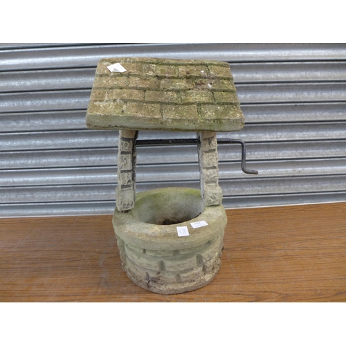 2304 - A concrete wishing well garden ornament