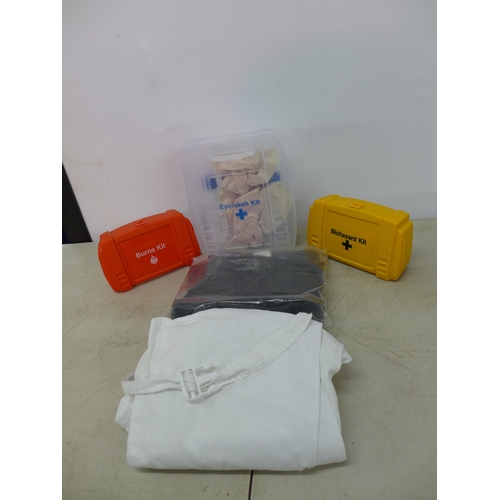 2339 - A box of first aid kits and workwear clothes