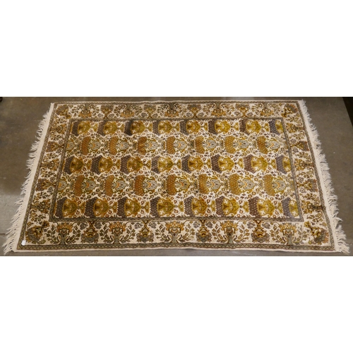 120A - A small Kashmiri cream ground rug