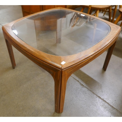 64 - A G-Plan teak and glass topped coffee table