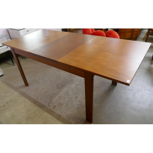 65 - A Danish Mogens Kold teak extending dining table