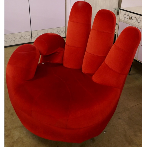 A red fabric OK hand shaped chair