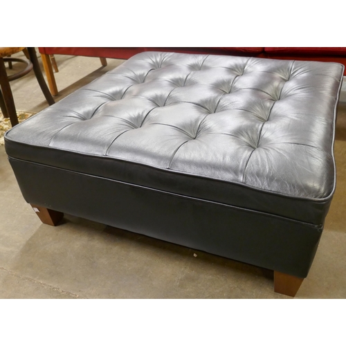 79 - A black leather ottoman