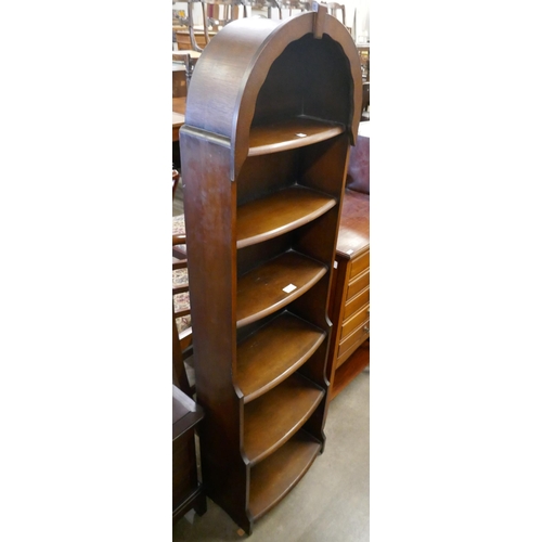 85 - An oak waterfall front open bookcase