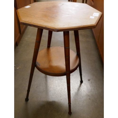 90 - A small Arts and Crafts walnut octagonal occasional table