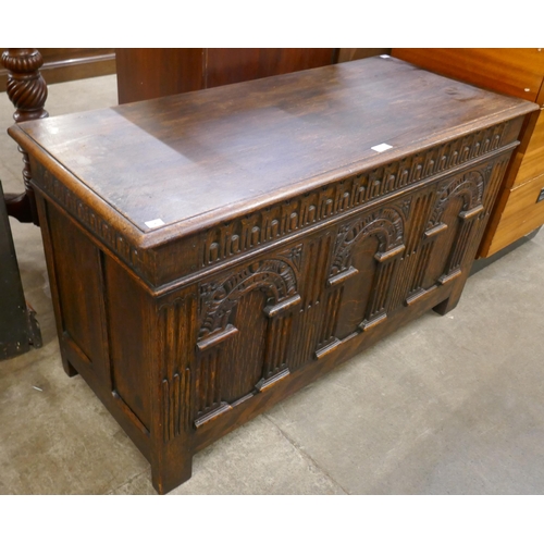 95 - A 17th Century style carved oak blanket box