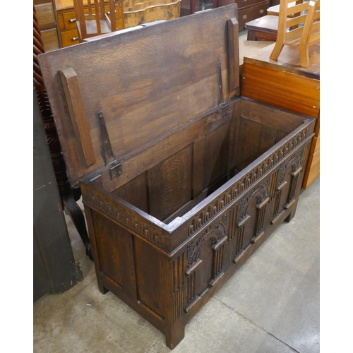 95 - A 17th Century style carved oak blanket box