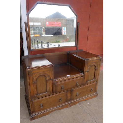 150B - A carved oak dressing table