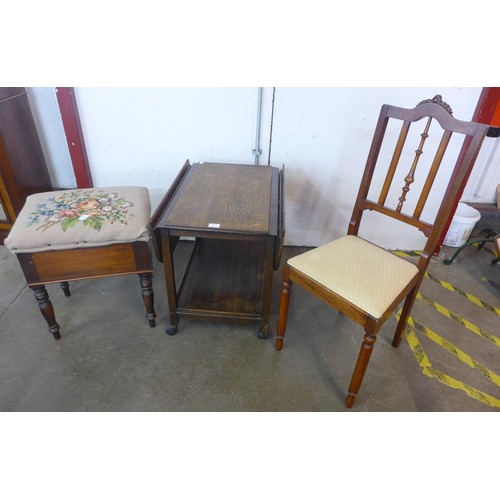 190A - An oak drop-leaf trolley, a piano stool and a hall chair