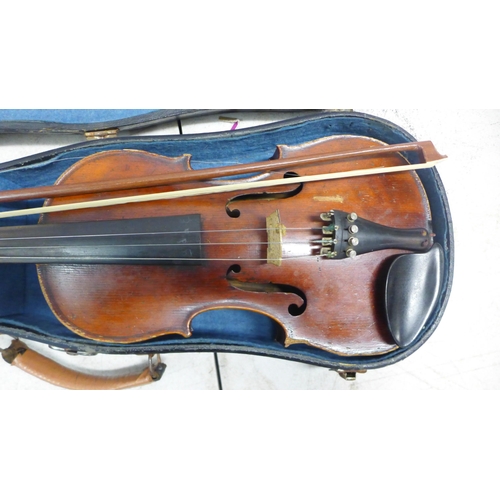 2083 - A violin and bow in case