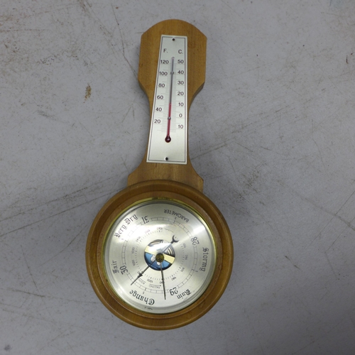 2100 - A long cased wall clock and two barometers