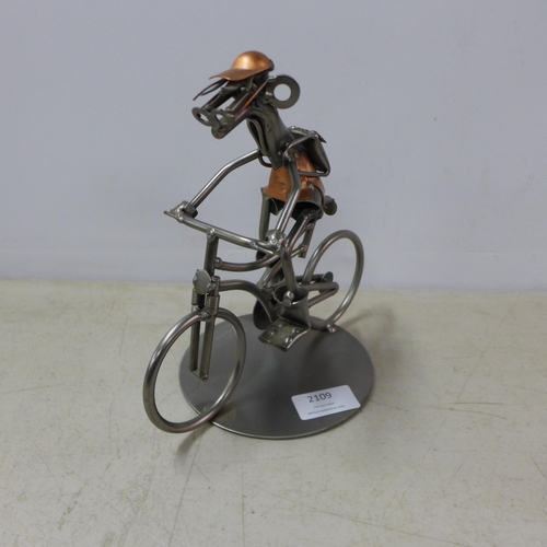 2109 - The Atrium collection metal figurine man on bicycle