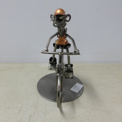 2109 - The Atrium collection metal figurine man on bicycle