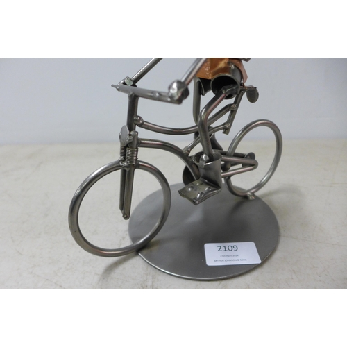 2109 - The Atrium collection metal figurine man on bicycle