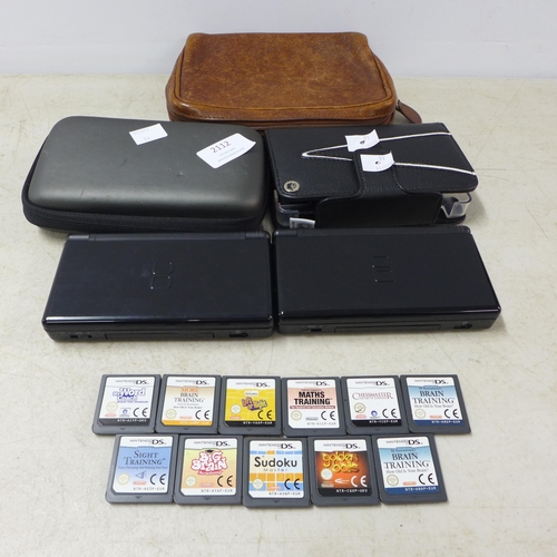 2112 - Two black Nintendo DS consoles with charger and a quantity of games including Maths Training, Chess ... 