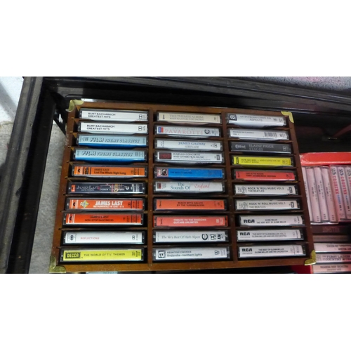 2133 - A large collection of approx.13 boxes of assorted tape cassettes featuring a wide range of different... 