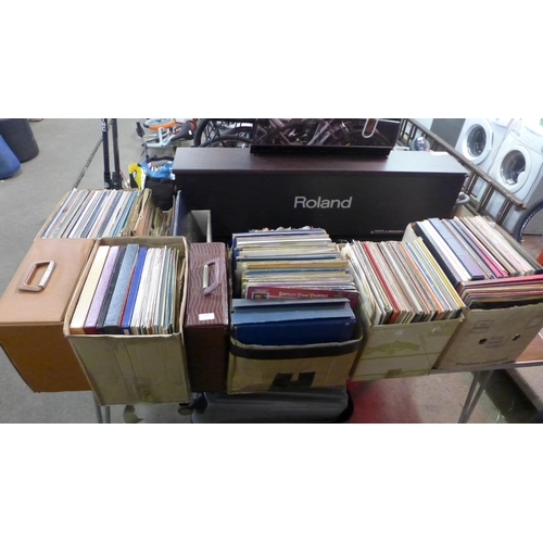 2139 - A large collection of 8 boxes of assorted LP records and 7” singles featuring a wide range of differ... 