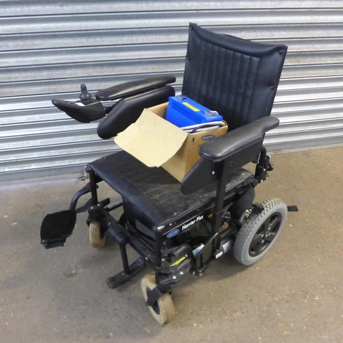 An Invacare Harrier plus electric wheelchair with boxed Invacare charger
