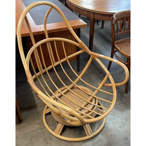 77 - An Italian style bamboo revolving lounge chair