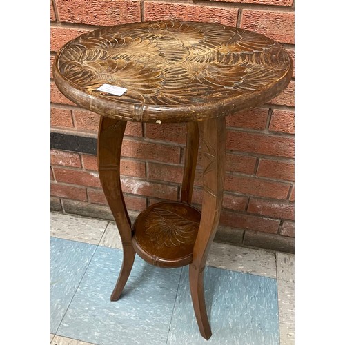 125 - A Liberty & Co. Japanese range carved wood occasional table