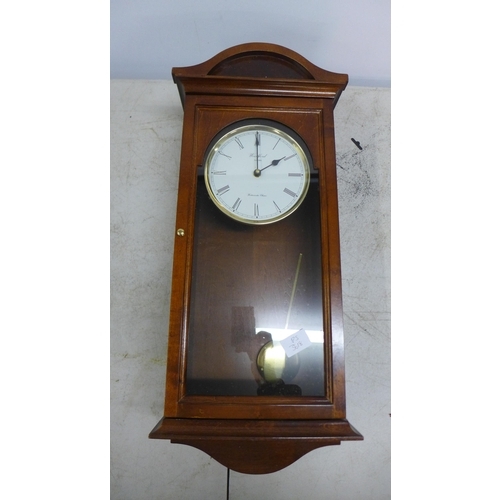 2100 - A long cased wall clock and two barometers