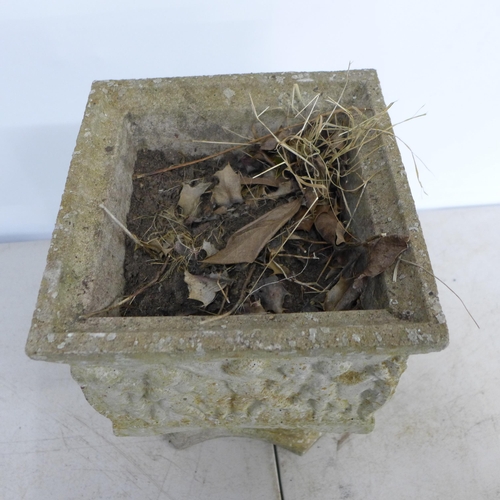 2307 - A small square concrete pedestal planter