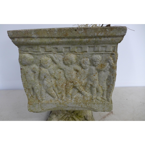 2307 - A small square concrete pedestal planter