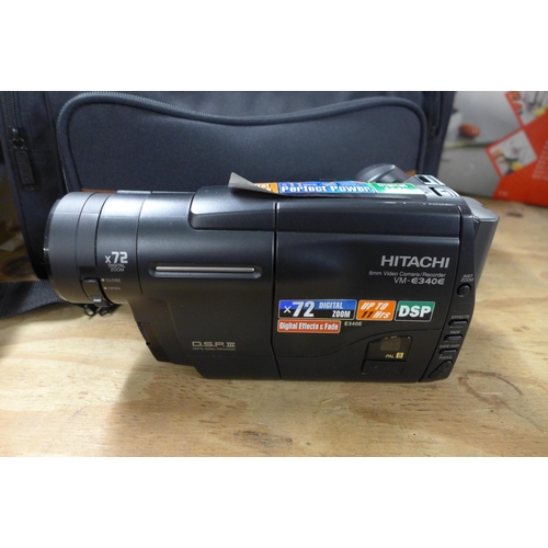 2373 - A Hitachi VM-E340E (R) 8mm video camera/recorder with protective carry bag, charger, a pack of 8mm v... 