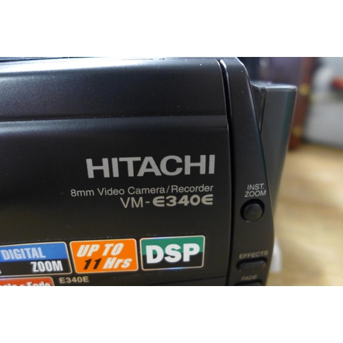 2373 - A Hitachi VM-E340E (R) 8mm video camera/recorder with protective carry bag, charger, a pack of 8mm v... 