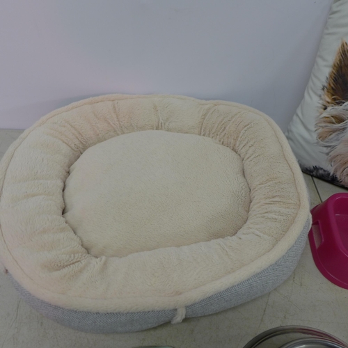 2429 - A collection of assorted pet bowls with dog themed pillow and a small dog bed.