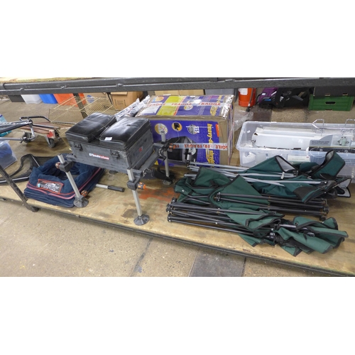 2430 - A quantity of fishing equipment including three folding chairs, a fast dry 'The Works' Middy free fl... 