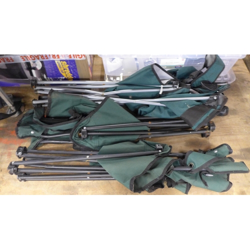 2430 - A quantity of fishing equipment including three folding chairs, a fast dry 'The Works' Middy free fl... 