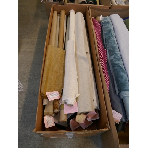 1584 - A box of upholstery fabric part rolls and roll ends