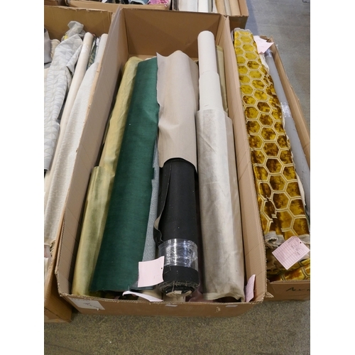 1582 - A box of upholstery fabric part rolls and roll ends