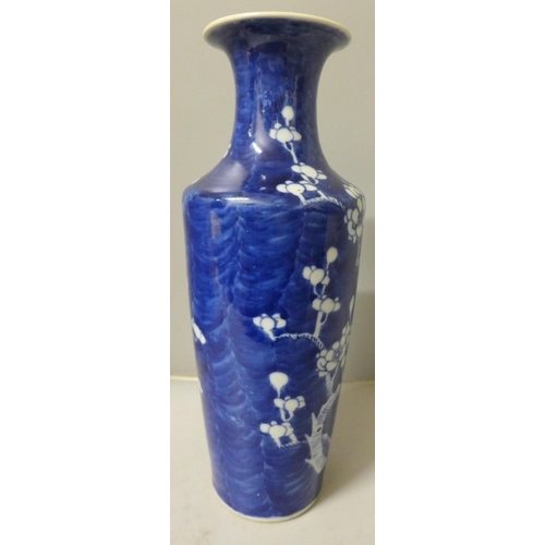 798 - A blue and white Chinese vase with prunus decoration, four character mark to base, 30cm, small repai... 