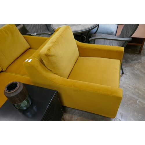 1392 - A turmeric velvet armchair