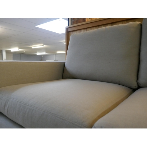 1504 - A pair of mink upholstered three seater sofas