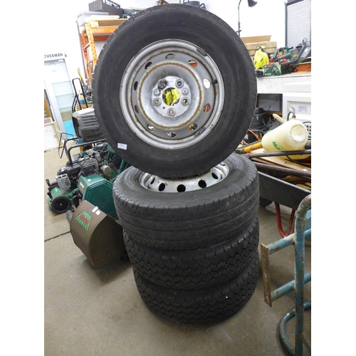 2233 - A set of four wheels and tyres to fit a Peugeot Boxer Van with hub caps and lug nuts included