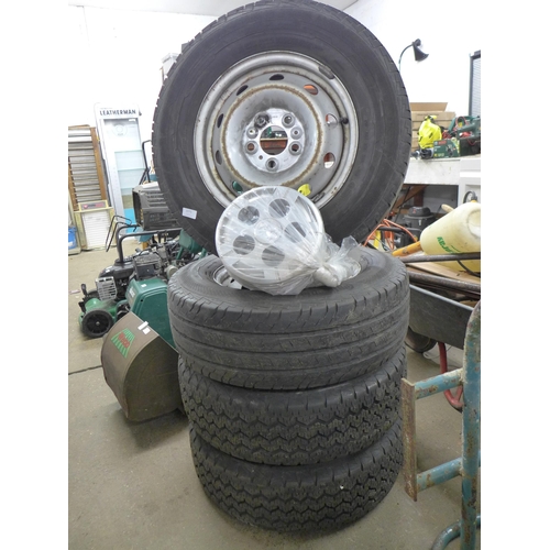 2233 - A set of four wheels and tyres to fit a Peugeot Boxer Van with hub caps and lug nuts included