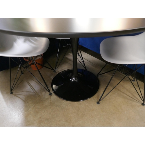 1373A - A black Tulip table - RRP £399 and Charles and Ray Eames style four chairs