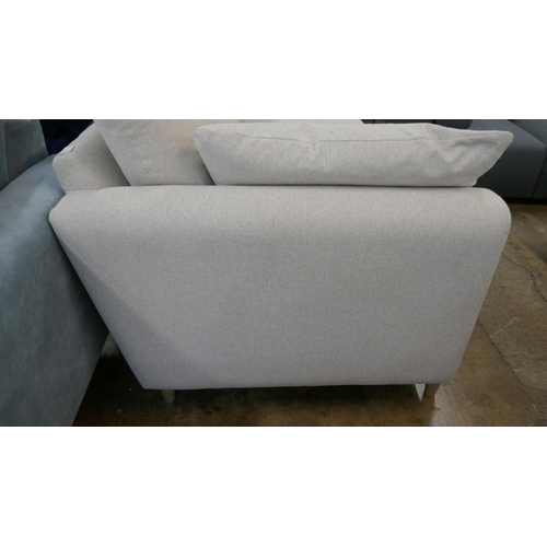 1431 - An oatmeal  upholstered 2.5 seater sofa on semi exposed frame