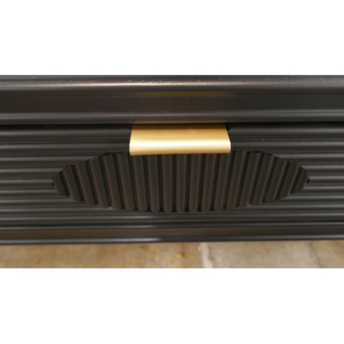 1435 - A three drawer black console with gold legs