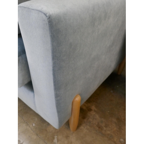 1438 - A steel blue velvet two seater sofa on semi exposed frame