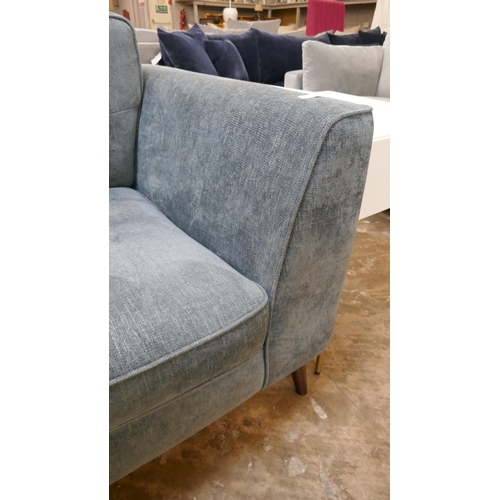 1440 - A dark teal velvet three seater sofa