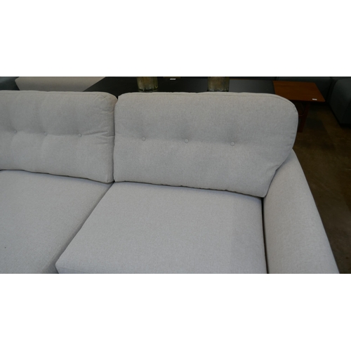 1442 - An oatmeal upholstered L shaped sofa